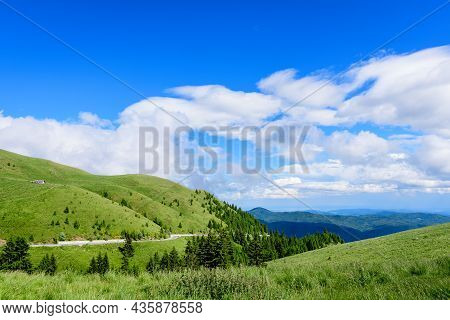 Scenic View Over Bucegi Mountains (muntii Bucegi) In Romania In A Sunny Summer Day With Clear Blue S
