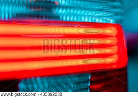 Close-up Photo Of Ncluded Red Headlight Auto.