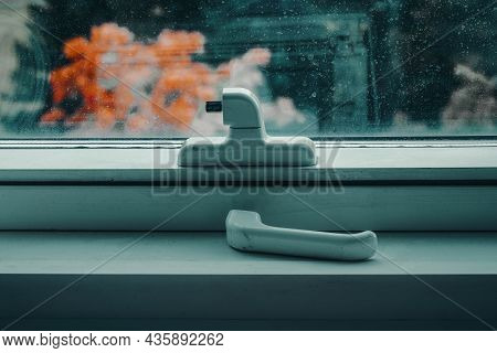 Photo Of A Broken White Handle From A Window.