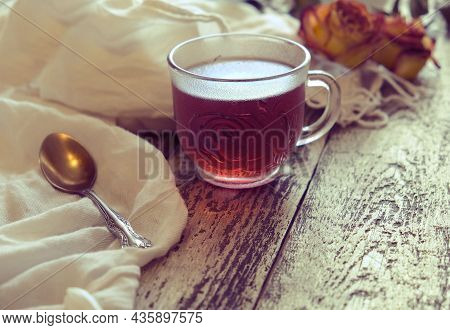 Cup Of  Tea, Neutral Scarf On Wooden Table, Sun Glare And Bokeh, The Concept Of Home Comfort, Retro 