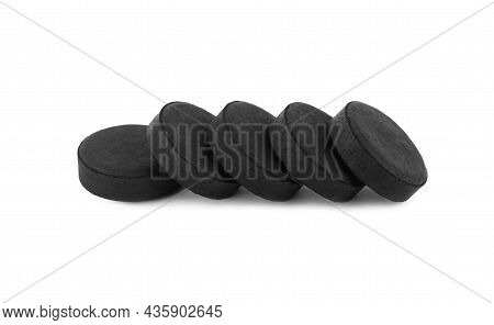 Activated Charcoal Pills On White Background. Potent Sorbent