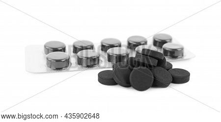 Activated Charcoal Pills On White Background. Potent Sorbent