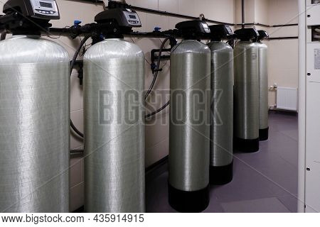 Several Water Softener Filters For Water Stand In A Row.water Treatment System.ecology.