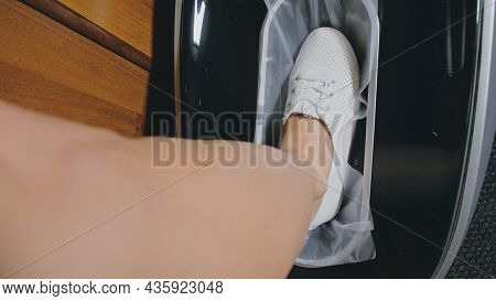 Automatic Thermal Shrinkable Shoe Cover Laminating Machine. Close Up. Machine Automatically Applies 