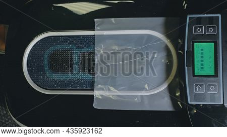 Automatic Thermal Shrinkable Shoe Cover Laminating Machine. Close Up. Machine Automatically Applies 
