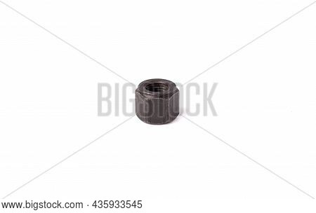 One Macro Metallic Nut Isolated On White Background. Heavy Hex Nut. Female Screw Nut With Copy Space