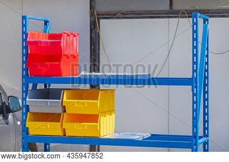 Plastic Tray Bins At Shelf In Garage Storage Space