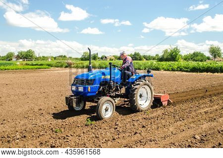 Kherson Oblast, Ukraine - May 28, 2020: Farmer Cleans And Turns The Soil In The Farm Field For Furth
