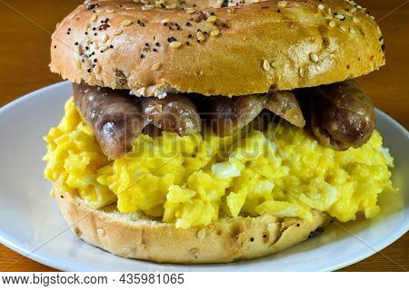 Scramble Egg  With Sausage Between An Everything Bagel,