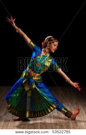 Young beautiful woman dancer exponent of Indian classical dance Bharatanatyam