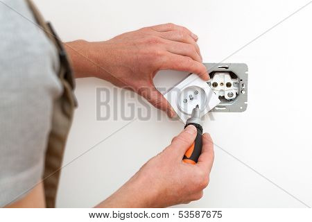 Electrician Repairing Socket