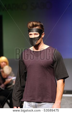 ZAGREB, CROATIA - NOVEMBER 07: Fashion model wearing clothes designed by Marko Sabo on the Fashion Wardrobe show on November 07, 2013 in Zagreb, Croatia.