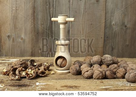 Walnuts Cracked Open With A Vintage Wooden Nut Cracker