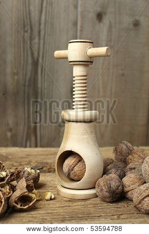 Walnuts Cracked Open With A Vintage Wooden Nut Cracker