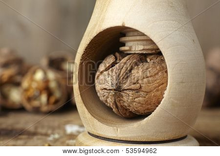 Walnuts Cracked Open With A Vintage Wooden Nut Cracker
