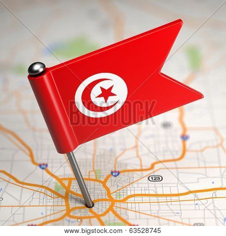 Tunisia Small Flag on a Map Background.