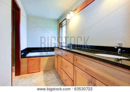 Bathroom With Black Tile Trim
