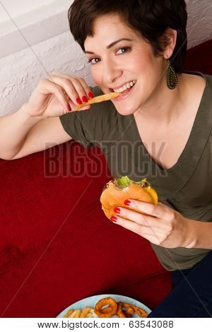 Happy Healthy Young Adult Woman Eats Fast Food Cheesburger Lunch