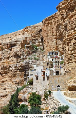 The famous Orthodox monastery of St. George Cozeba. The building of the monastery was built on the wall of the gorge of Wadi Kelt near Jerusalem. The main entrance