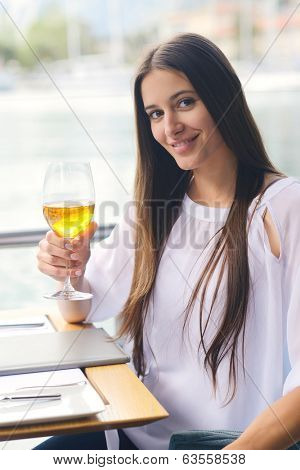 happy young couple having lanch at beautiful restaurant on by the sea on  beach