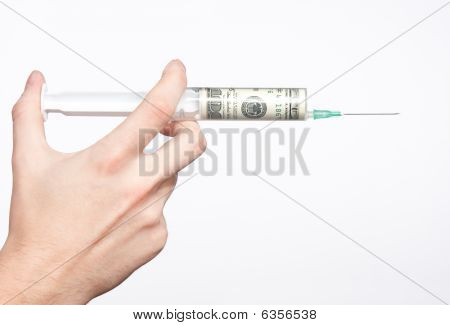 Siringa riempita con valuta
