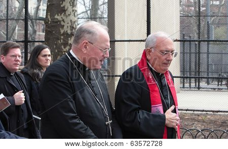 Archbishop Timothy Nolan (lt) walks with Bishop Nicholas Dimarzo