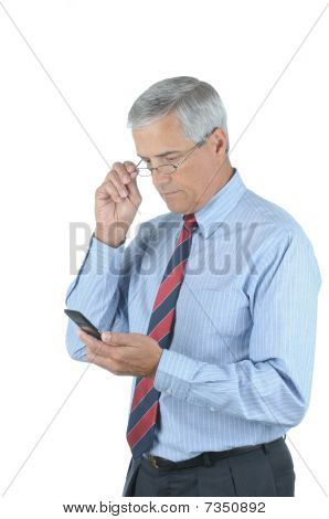 Středního věku, podnikatel a mobilní telefon