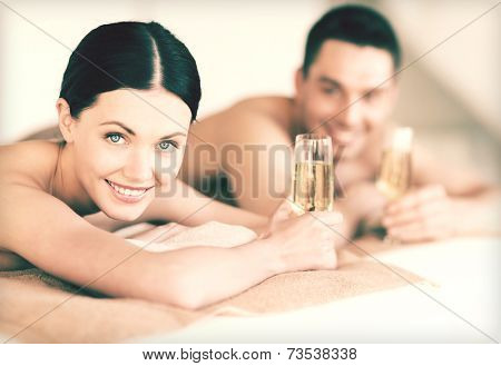 picture of couple in spa salon drinking champagne