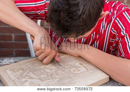 Bboy In Traditional Clothes From Urk Is Making A Wood Carvin