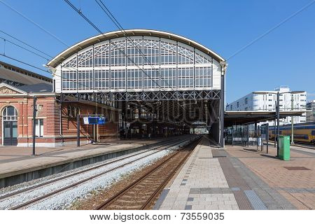 Passengers Waiting At A Train Station Of The Hague, The Netherlands