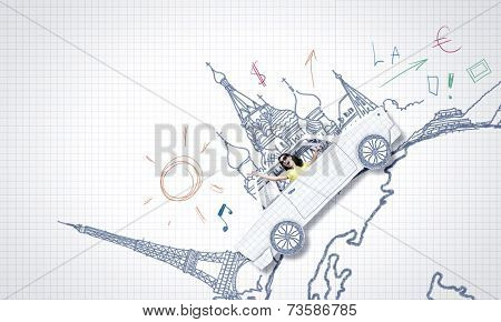 Young woman riding car made of list of paper
