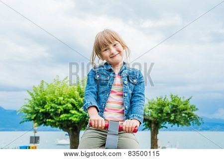 Outdoor portrait of a cute little girl