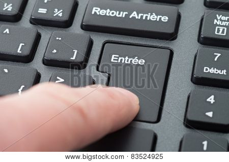 Close up of a black computer french keyboard focus on enter key