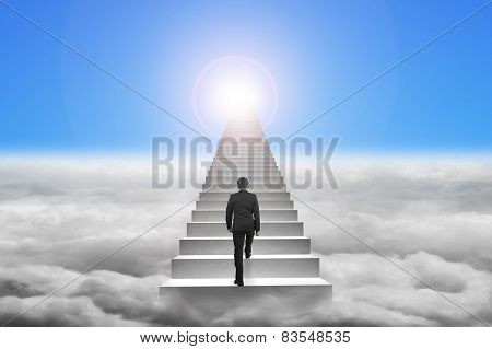 Businessman Climbing The Concrete Stairs With Blue Sky Sunlight Cloudscape