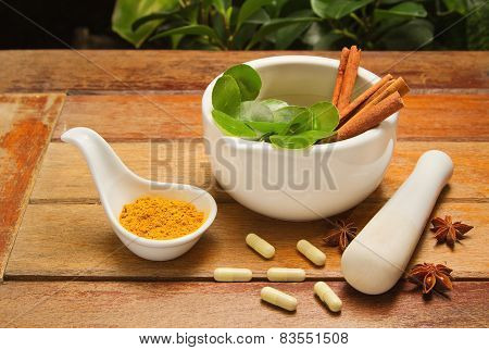 Mortar And Pestle With Herb And Pills