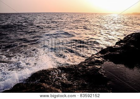 Strong Waves Crashing on the Volcanic Coast