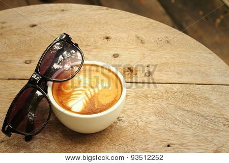Coffee With Sun Glasses On Background Of Wooden.