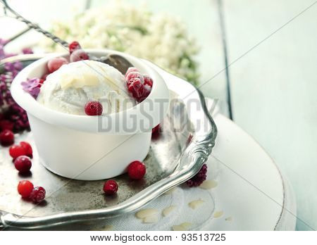 Beautiful composition with tasty ice cream and lilac flowers