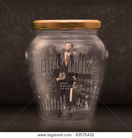 Businessman traped in jar with graph chart symbols concept on background