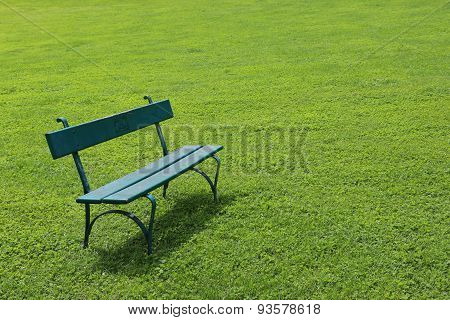 Lonely bench on short cut grass