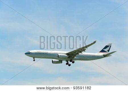 HONG KONG - JUNE 04, 2015: Cathay Pacific aircraft landing. Cathay Pacific is the flag carrier airline of Hong Kong, with its head office and main hub located at Hong Kong International Airport