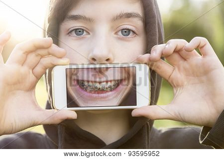 Virtual Realty, Teenage Boy Holding A Smart Phone In Front Of His Face