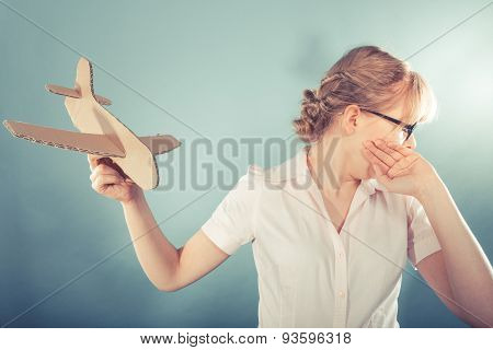 Fly Fear. Woman Holding Airplane In Hand.