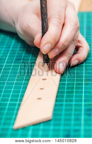 Punching Holes In Leather Belt With Hole Punch