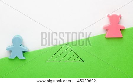 Male and female figurines forming concept of gender inequality - Male advantage