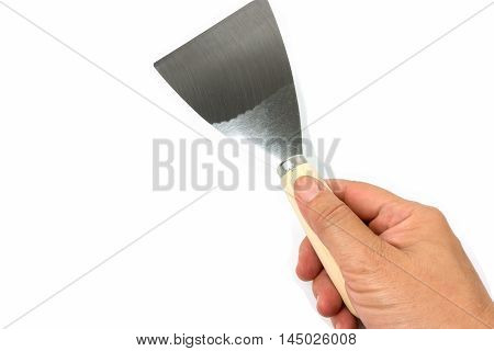 steel putty spattles in hand on white background.