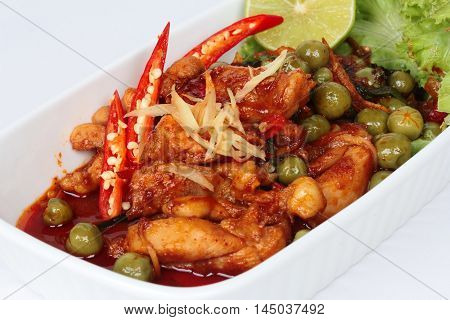Spicy fried chicken in roasted chili sauce on selective focus.