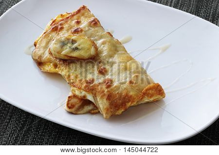 Roti ,deep fried flour with eggs and banana topping