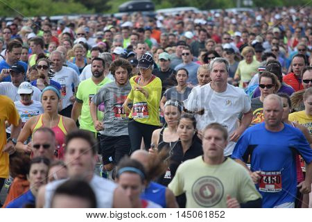 Spring Lake NJ 07762 - May 24 2014. Runners bunched up at the beginning of the annual Spring Lake 5k race. Editorial Use Only.
