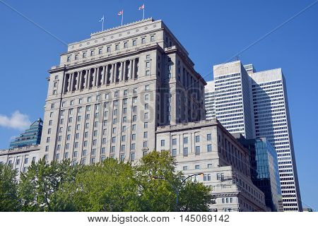 MONTREAL QUEBEC CANADA AUGUST 30 2016: The Sun Life Building is an historic office building at 1155 Metcalfe Street. Place ville Marie in background.